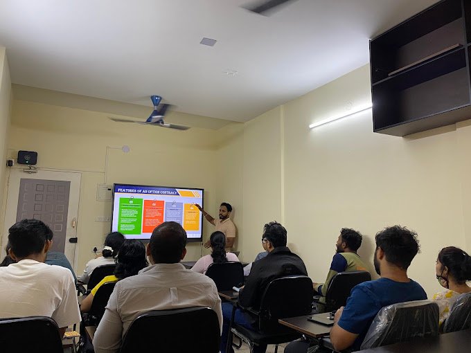 Students learning live market trading at a stock market training institute in Mangalore